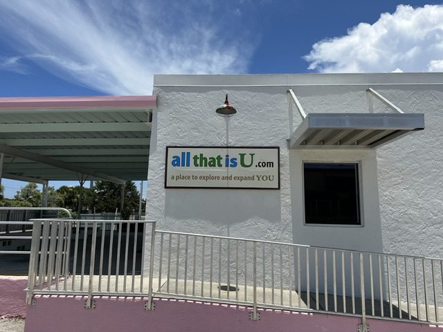 A building with a cross on the top of it.